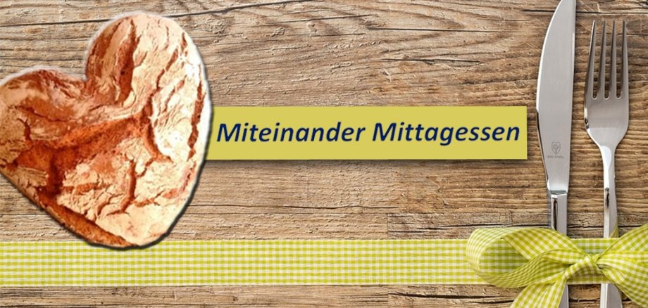 Brot in Herzform und Besteck